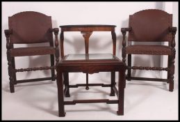 A pair of 1920's Jacobean revival carver armchairs with leatherette covers together with a Chinese