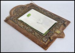 A Victorian brass gypsy mirror of large form with upholstered back panel,