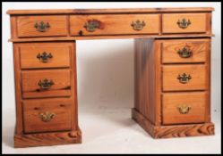An antique style country pine twin pedestal office desk.