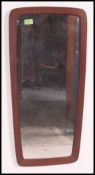 A retro 1970's atomic style teak wall mirror.
