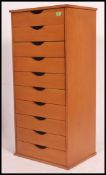 A contemporary pedestal beech wood chest of drawers for an artist.