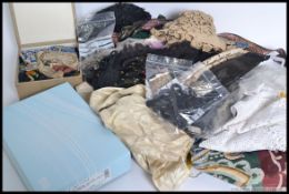 A collection of Victorian and later clothing materials, to include tassels, silks, wraps etc.