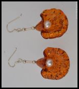 A pair of 925 white metal freshwater  pearl and amber style earrings