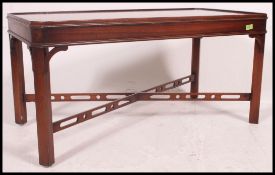 A good quality Bevan Funnell Reprodux Georgian revival tray top coffee table having pierced cross
