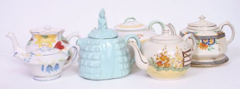 A collection of teapots to include Art Deco Circle Pottery, Ye Daintee Lady, Gibons,