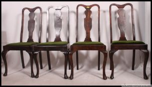 A set of 4 Edwardian Queen Anne mahogany dining chairs being raised on cabriole legs with green