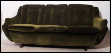 A good retro 1960's Parker Knoll teak upholstered sofa.