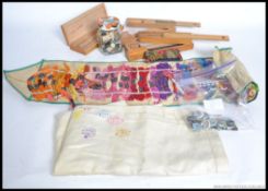 A collection of vintage sewing equipment in roll up case together with buttons.