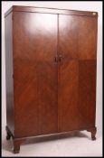 A good quality 1930's oak compactom wardrobe.