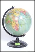 A mid century Philips Challenge desk top globe being raised on a ebonised metal plinth 35x25cm