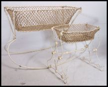 A Victorian cast iron painted Moses basket - childs cot on swing.