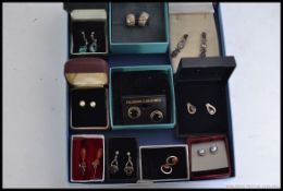 Ten pairs of ladies earnings to include silver and white metal , faux pearl ,