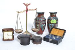 A pair of Chinese enamel set vases of decorative form with floral and geometric patination 1 x af.