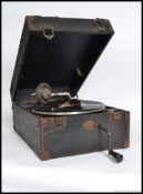 A vintage portable Decca gramophone, with handle and some accessories within the original case. AF.