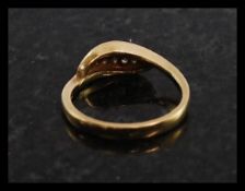 A ladies 9ct gold and diamond leaf set ring. The illustion set diamonds set within a leaf.