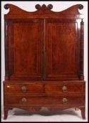 A 19th century Georgian mahogany inlaid linen press wardrobe.