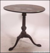 A 19th century Georgian mahogany tripod table.