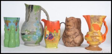 A collection of Art Deco ceramic jugs to include hand painted with examples by Rubian Art,