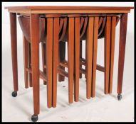 A 1970's retro teak nest of graduating tables,