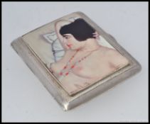 A silver and enamel cigarette case / calling card case with pictorial image to front of a nude. L8.