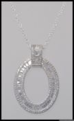 A 925 pendant necklace with large oval CZ Halo pendant with Buguette and round cut CZ.