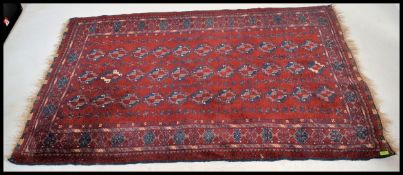 A fabulous Afghan Kayam rug being fine woven with red ground and geometric borders ( label to verso