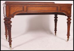 A mid 19th century Victorian / Regency mahogany writing table in the manner of Gillows.