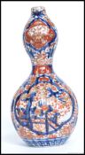 An late 19th century Imari pattern double fluted gourd vase.