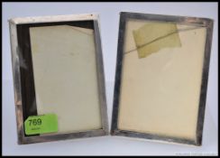 A pair of matching silver oak backed easel hallmarked picture frames,