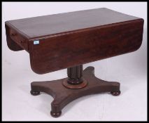 A 19th century Regency flame mahogany sofa table .