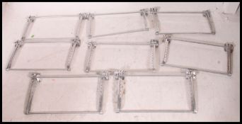 A fabulous set of 8 chrome 1970's carriage luggage racks.