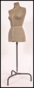 A 1950's Singer tailor's dress makers  dummy standing on an adjustable tubular metal stand on