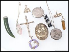 A collection of mainly silver pendants,