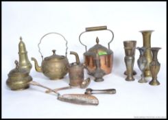 A collection of Asiatic brass wares to include Indian teapots, , vases, lidded pots etc.