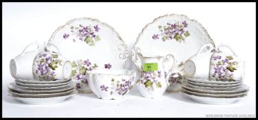 An early 20th century Staffordshire part tea service comprising cups, saucers,