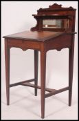 A Victorian / Edwardian ladies writing desk having raised stationary cabinet,