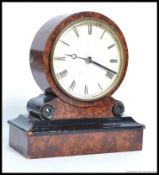 A late 19th early 20th century Walnut Drum head mantle clock, white face,