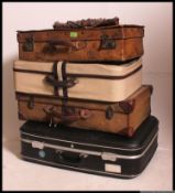A stack of vintage and retro suit cases to include a stunning leather example along with Demob,