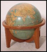 A fabulous large Webber Costello - Political REALITY Physical world globe being set within a wooden