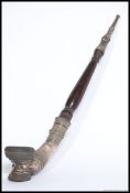 A long believed Tibetan silver and wooden opium pipe.