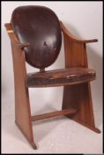A 1930's Art Deco style leather and oak cinema / theatre chair, bearing Rd No.