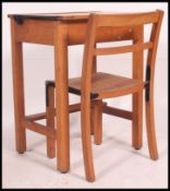 A retro mid century beechwood childs school desk and chair.