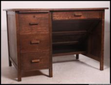 A fabulous mid century air ministry style oak metamorphic desk.
