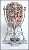 A stunning  Victorian ceramic Imari oil  lamp raised on a terraced silver plated stand being later