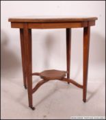 An Edwardian rosewood and marquetry inlaid centre table.