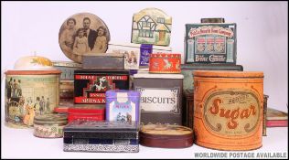 A collection of vintage tins from the 20th century to include large Sugar tin, biscuit tins,