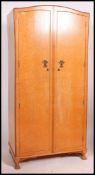 A 1930's Art Deco Matching ladies and gentlemans wardrobes in birds eye maple having fitted