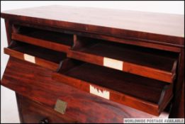 A Victorian gentlemans large mahogany chest of drawers having 4 slides to  fall front top drawers