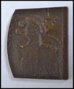 A bronze plaque cast in relief and struck with notation ' Immutabilis Amor ' With lovers to front,