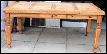 A large distressed refectory style Mexican Pine kitchen table,